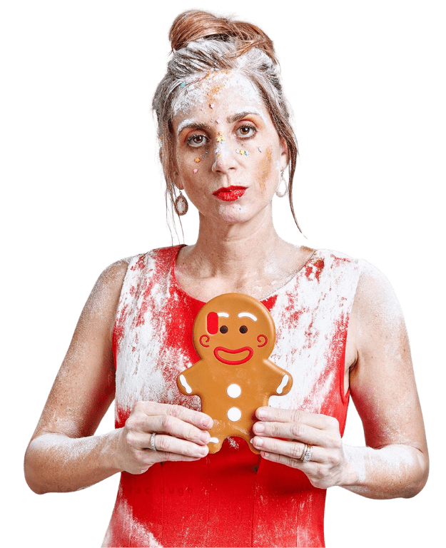 Red-dressed baker with flour holding gingerbread